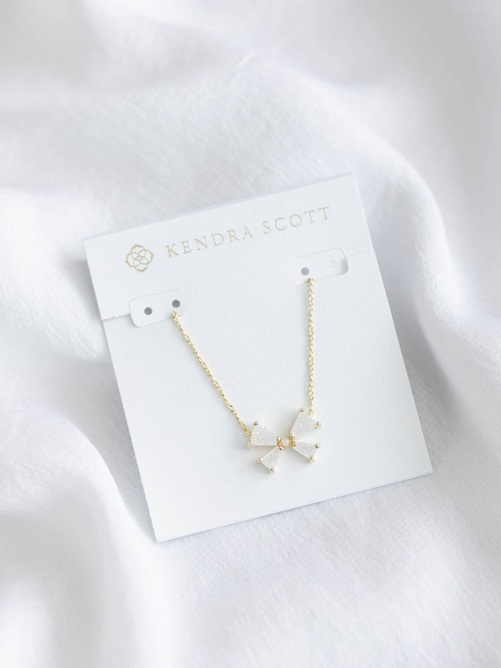 gold and white bow necklace